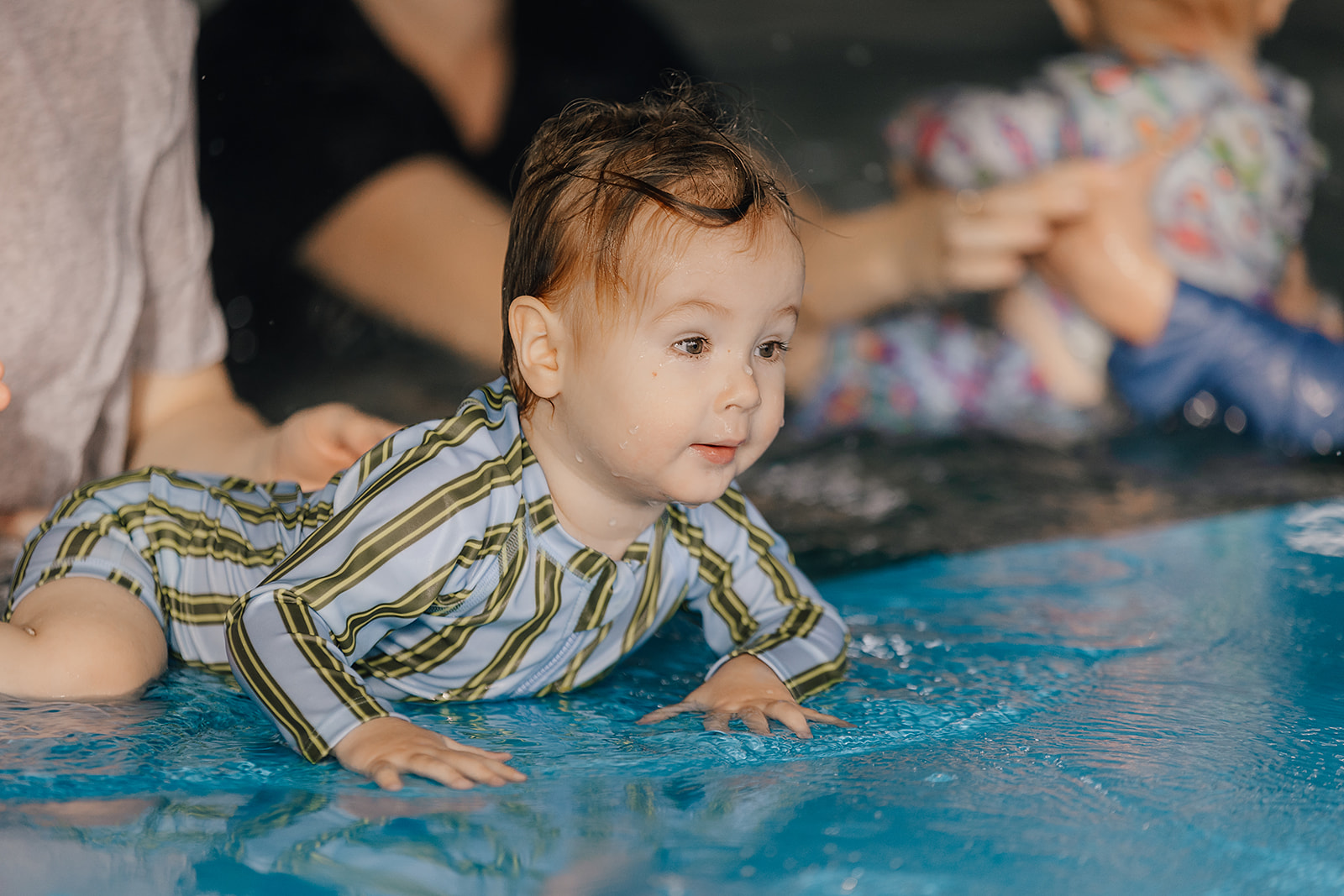 Parents and babies in a group class at Tri Swimming