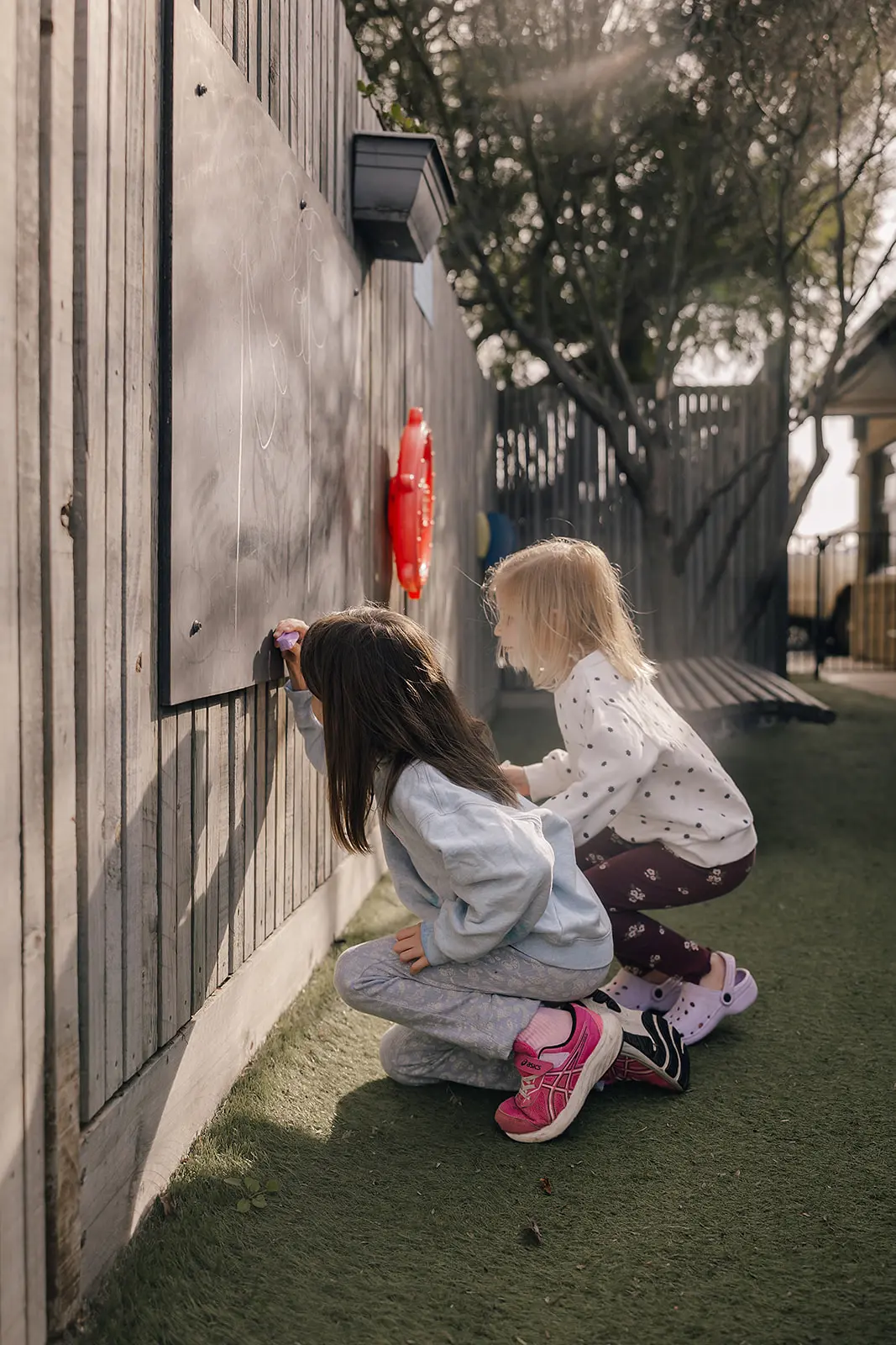 Children playing in the outdoor child safe area
