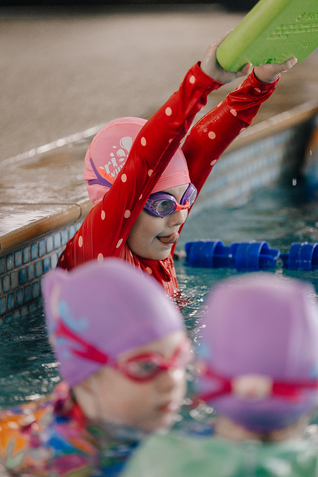 Child in the pool practising technique