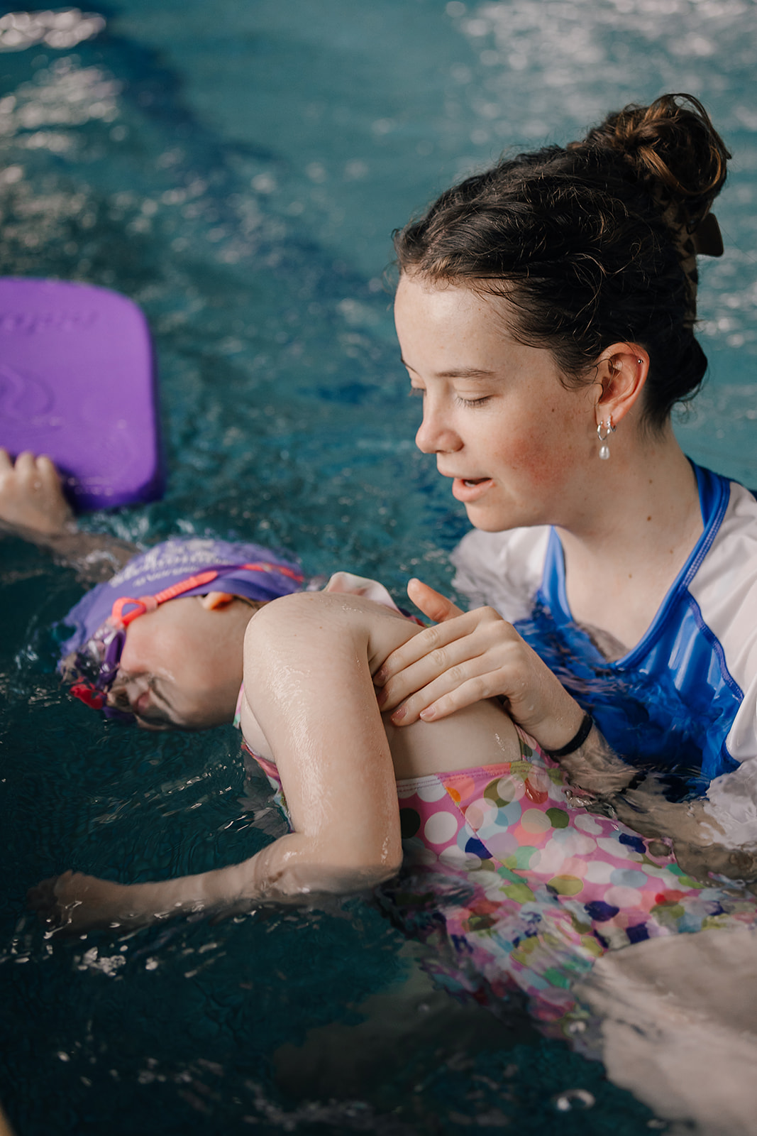 Toddler playing in the pool at Tri Swimming