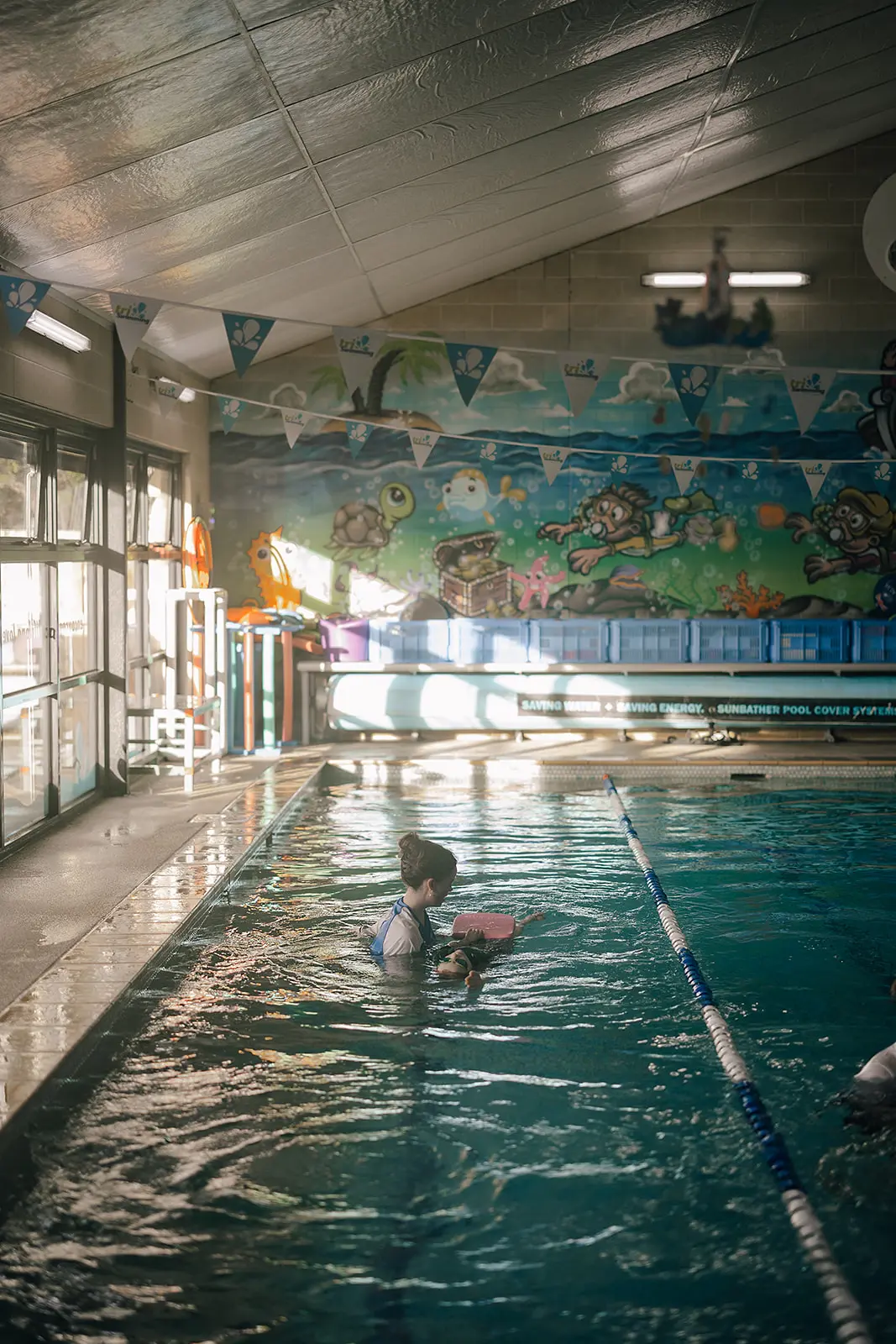 Wide view of the heated indoor pool at Tri Swimming